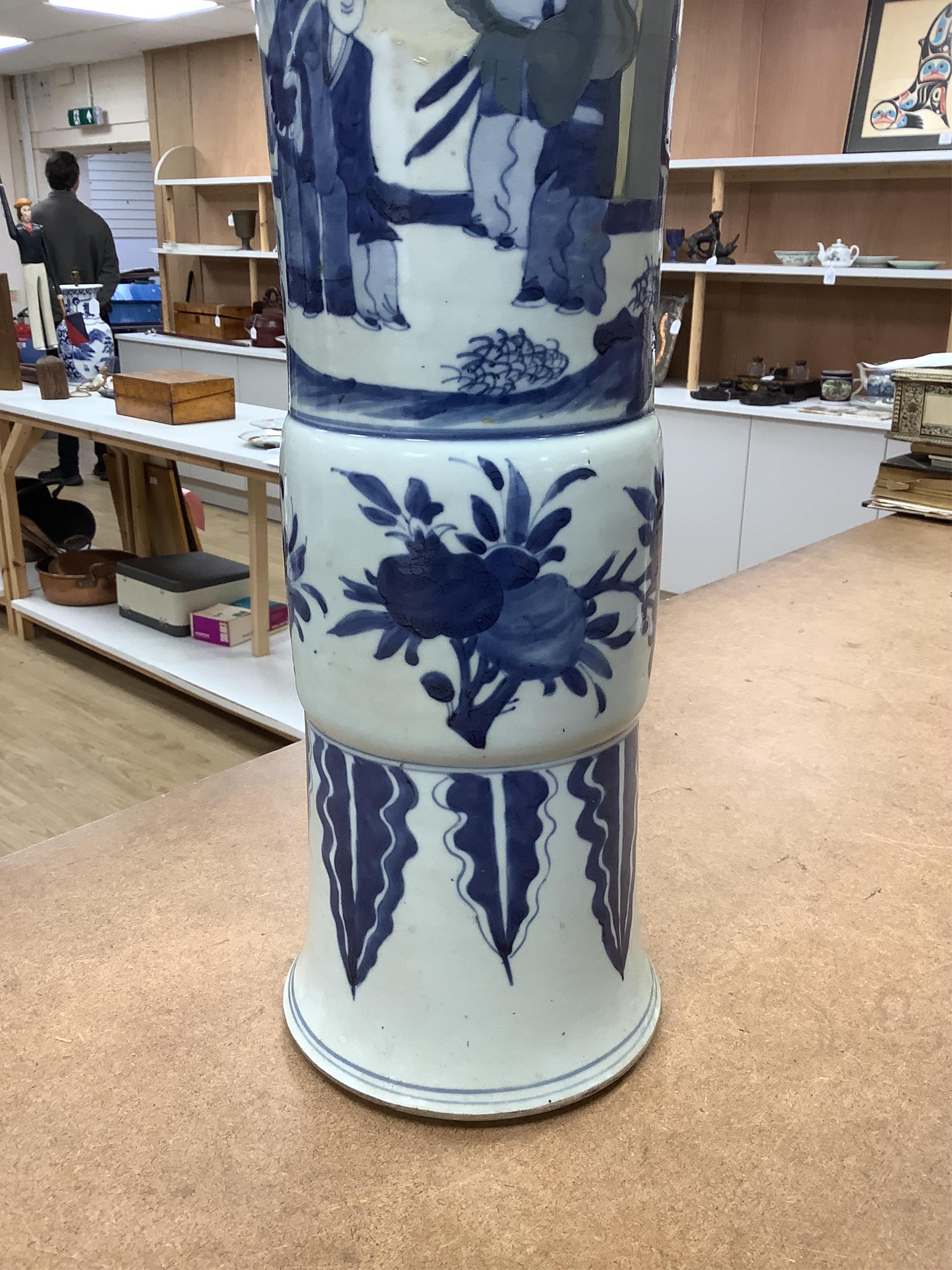 A Chinese blue and white sleeve vase. 53cm high. Condition - heavily restored.